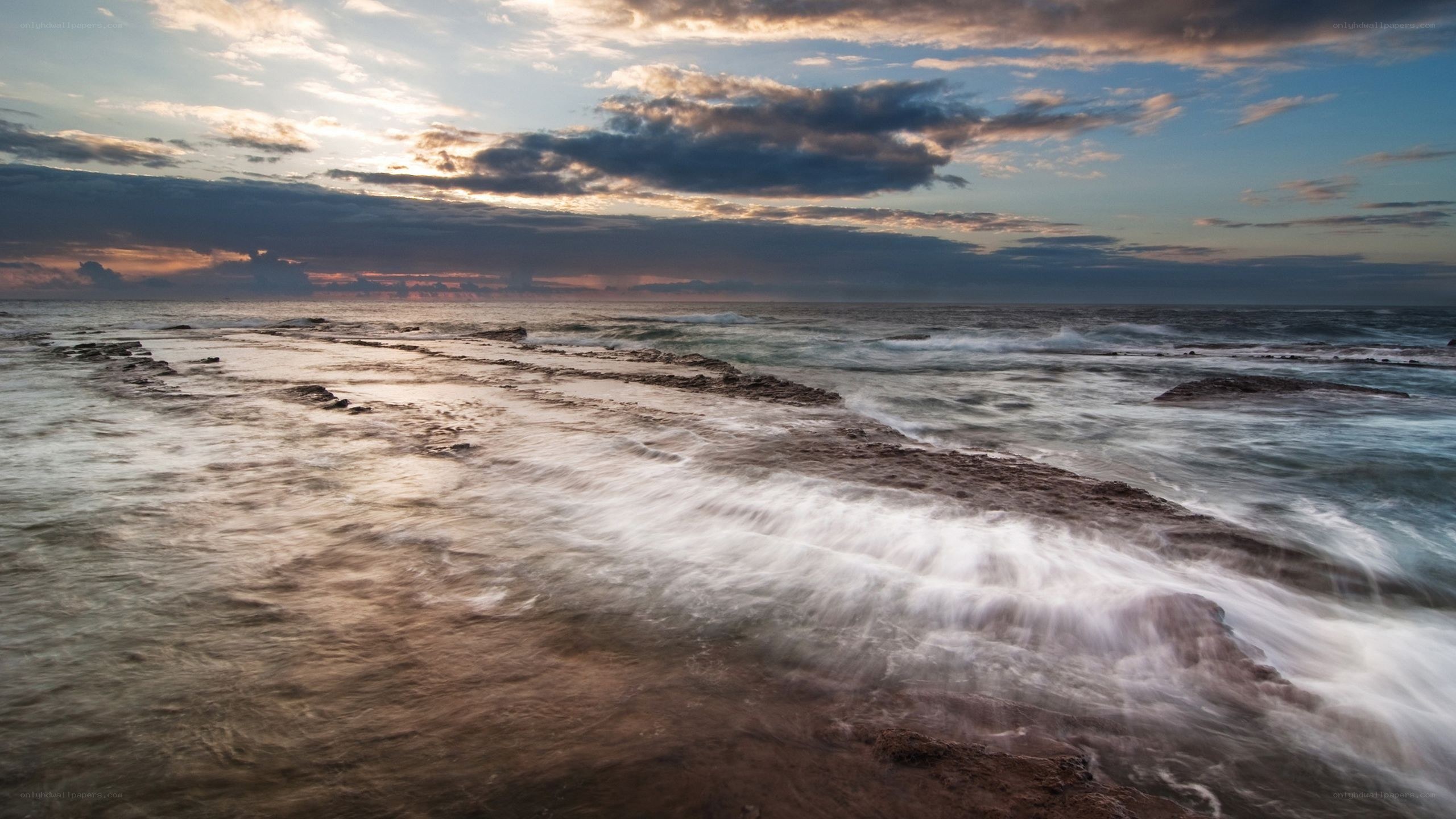 Ocean waves at sunset