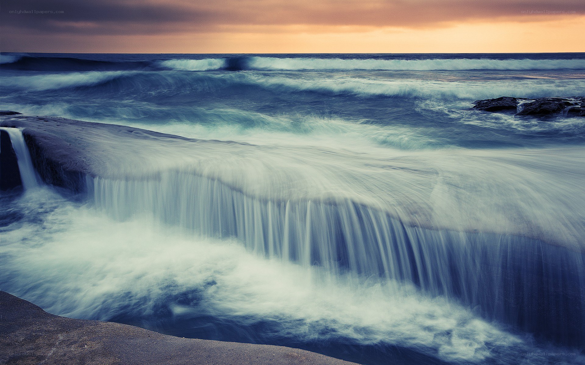 Ocean waves at sunset
