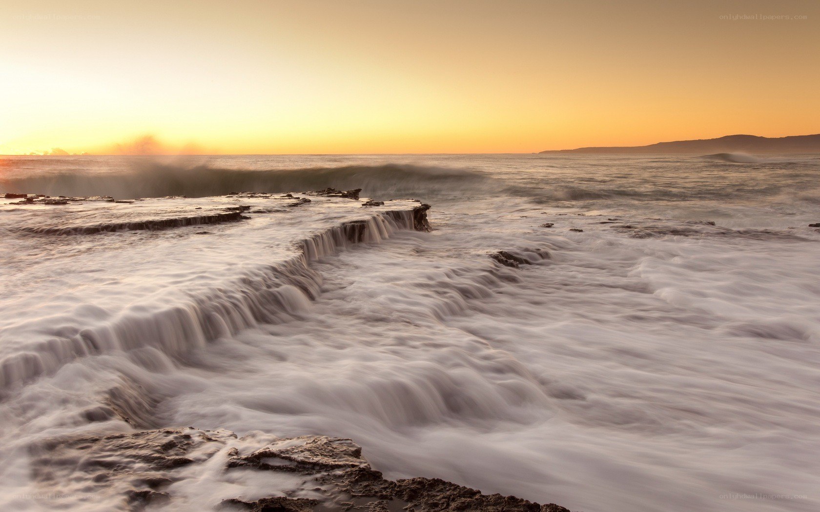 Ocean waves at sunset