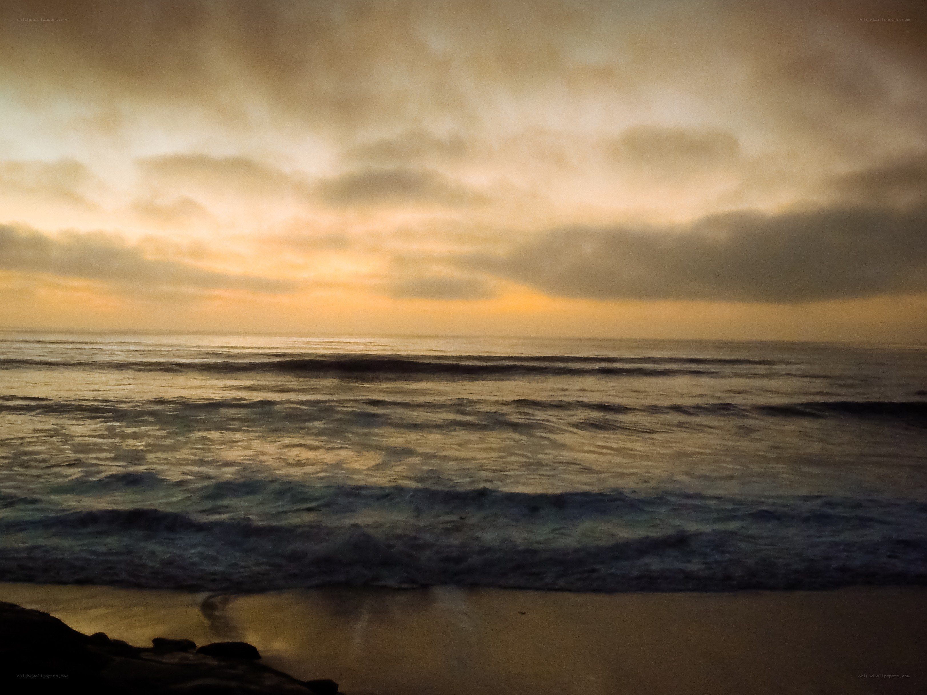 Ocean waves at sunset