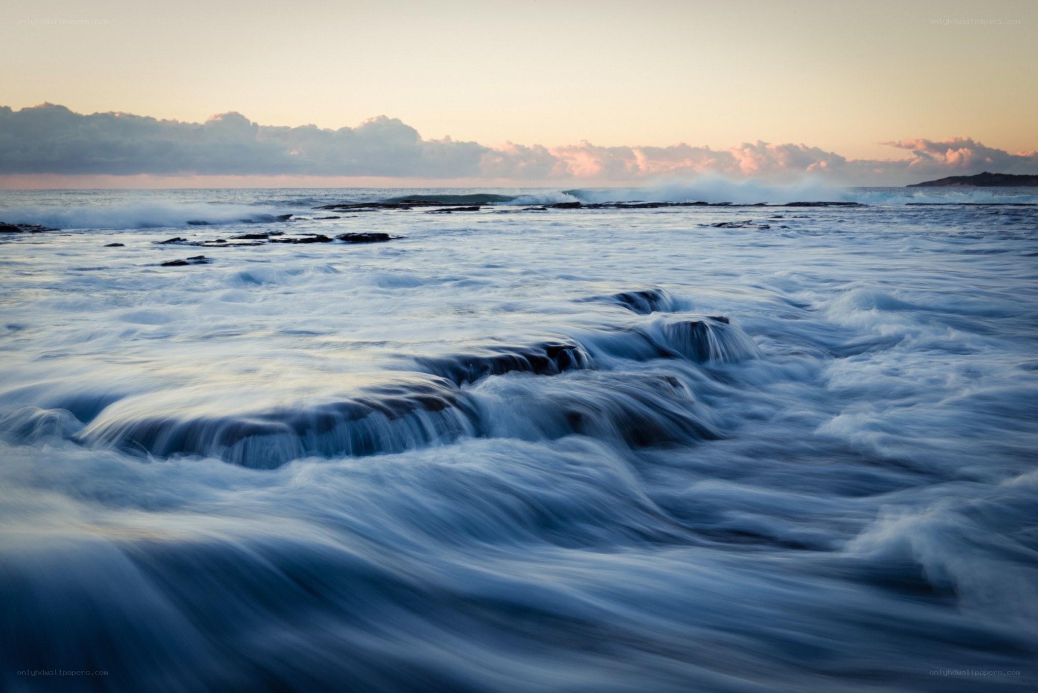 Ocean waves at sunset