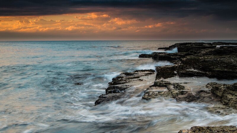 Ocean waves at sunset