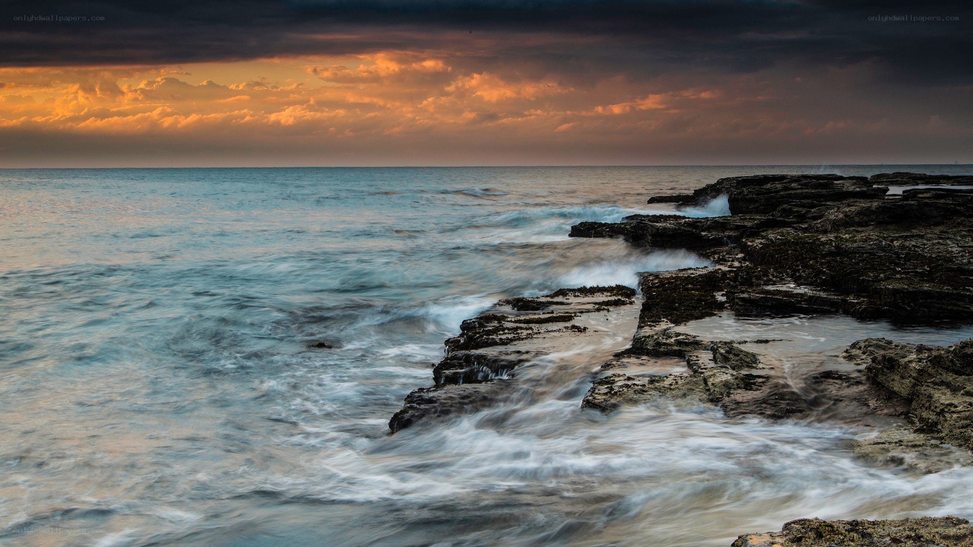 Ocean waves at sunset