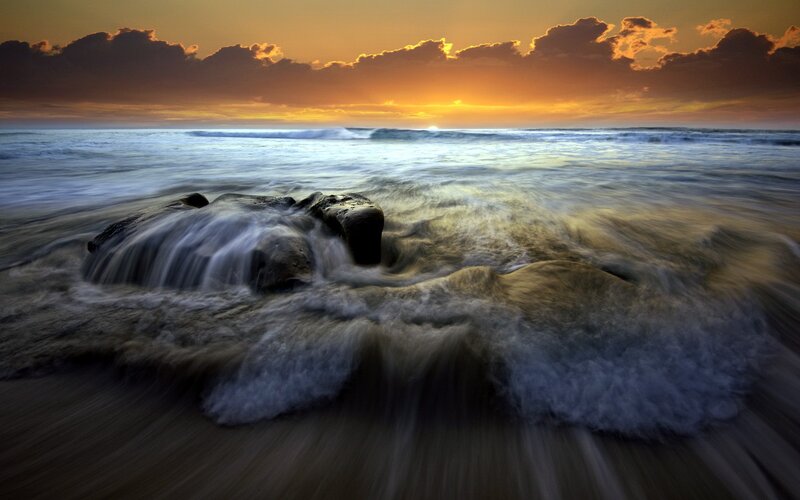 Ocean waves at sunset