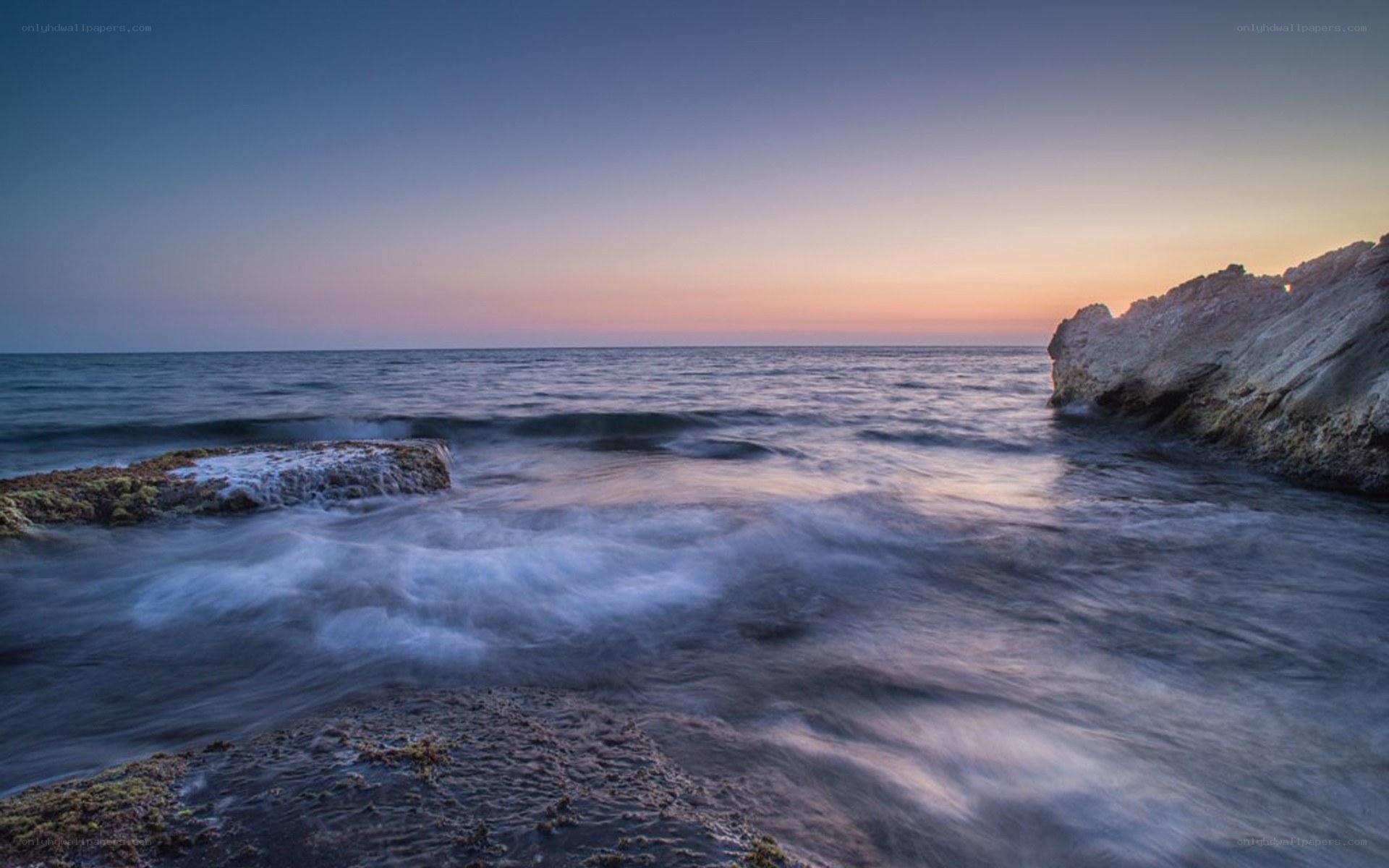 Ocean waves at sunset