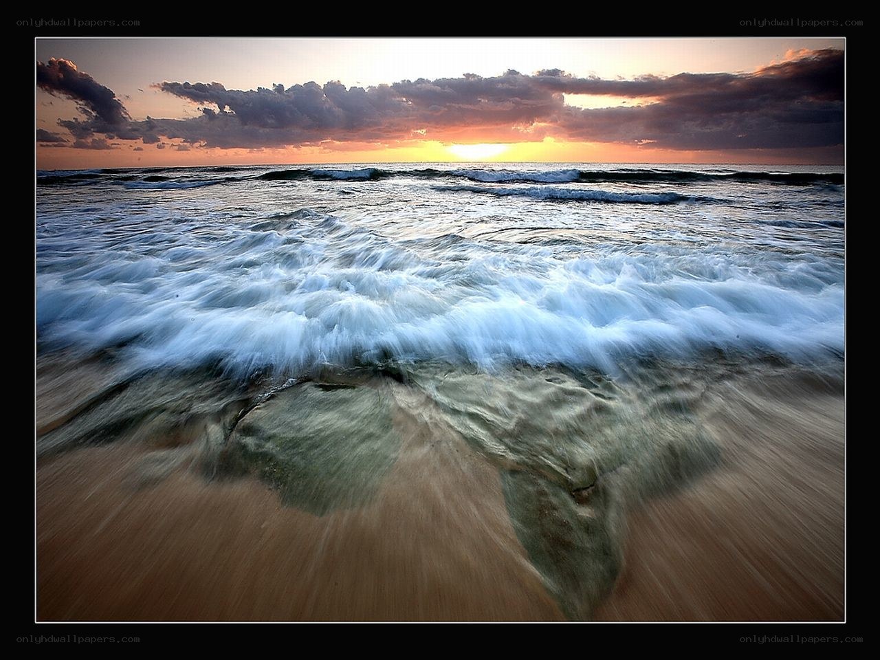 Ocean waves at sunset