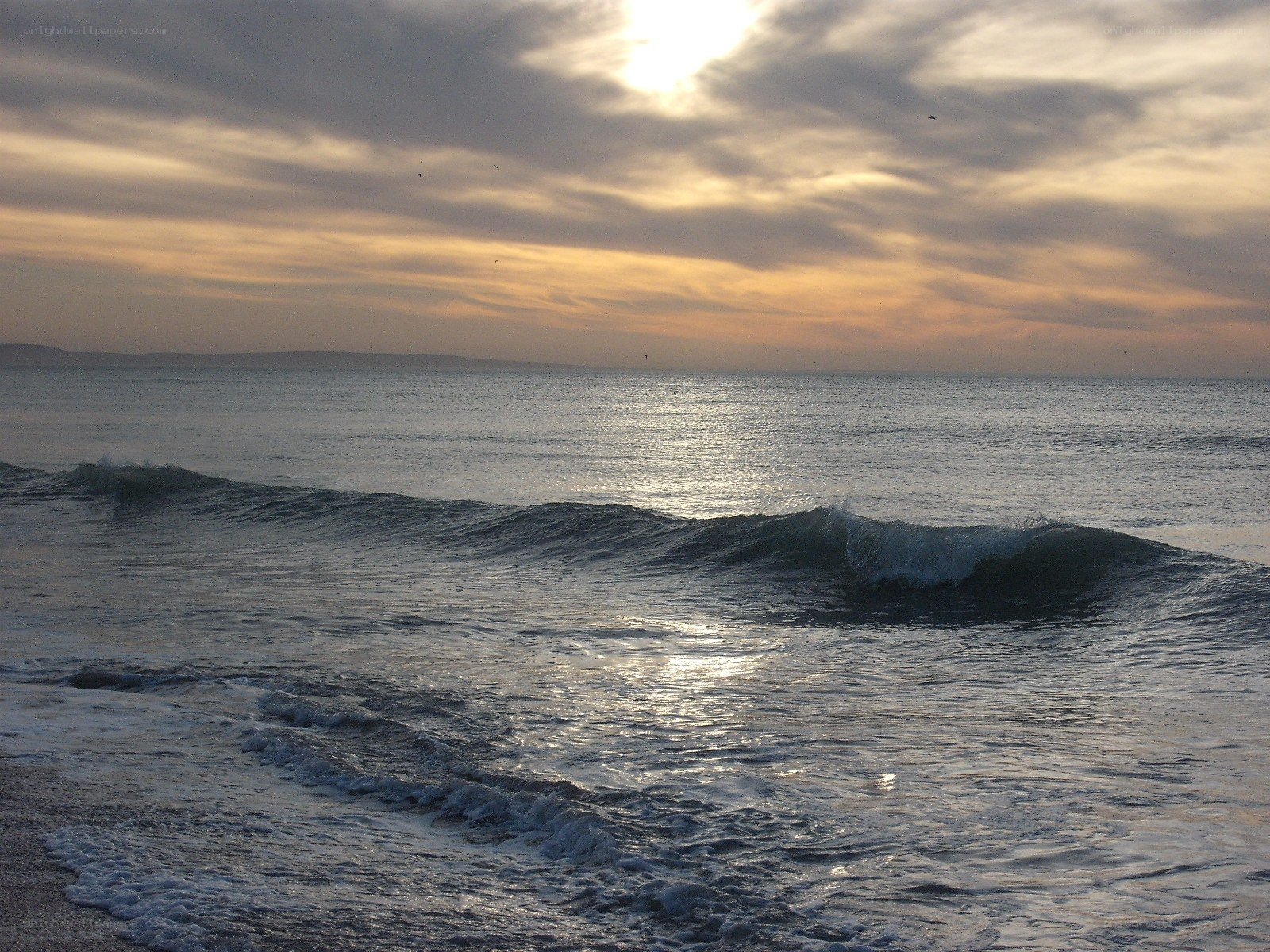Ocean waves at sunset