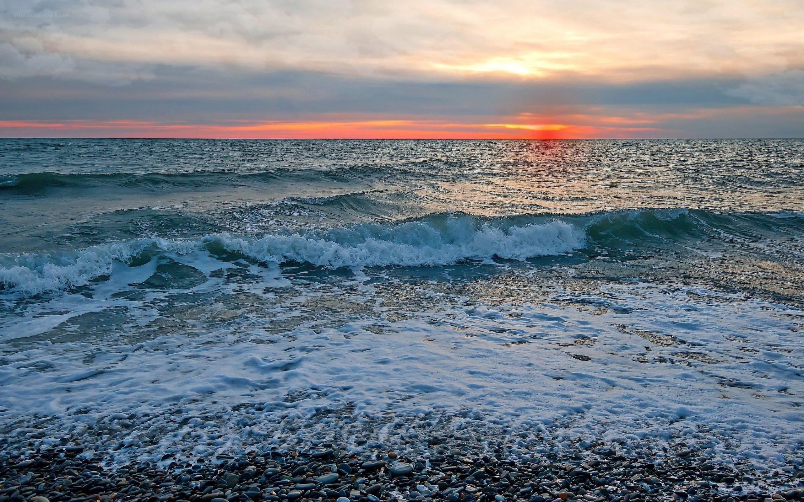 Ocean waves at sunset