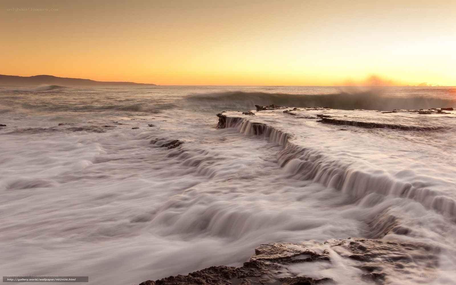 Ocean waves at sunset