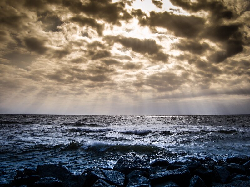 Ocean Waves at Sunset — Blue, Dramatic, Photograph, Clouds, Rocks, Sunlight
