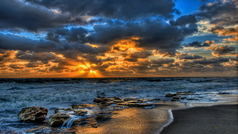 Ocean Waves at Sunset — Blue, Dramatic, Photograph, Clouds, Sun, Rocks, Sand