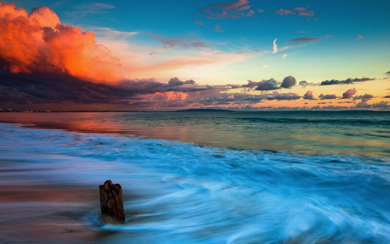 Ocean Waves at Sunset — Blue, Dramatic, Photograph, Clouds, Wooden Post