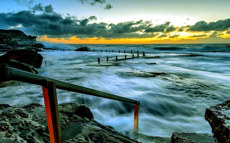 Ocean Waves at Sunset — Blue, Dramatic, Photograph, Rocks, Railing