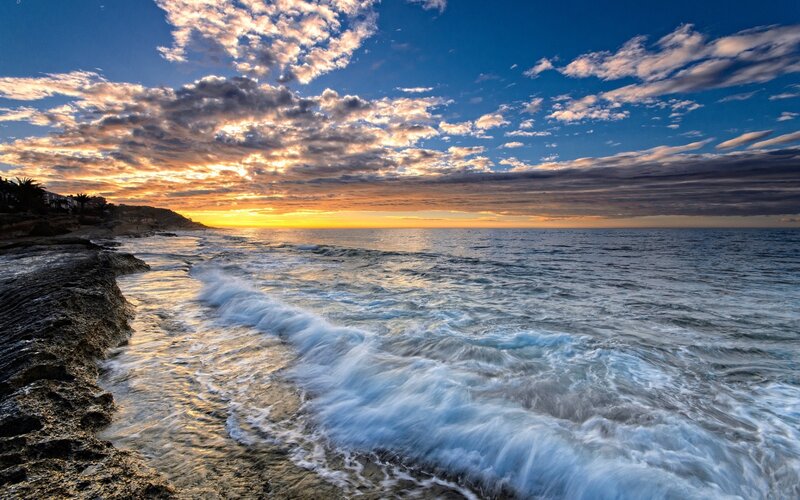 Ocean Waves at Sunset — Blue, Dramatic, Photograph, Sky, Clouds, Coastline, Orange