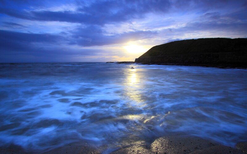 Ocean Waves at Sunset — Blue, Dramatic, Photograph, Sun, Clouds, Cliff