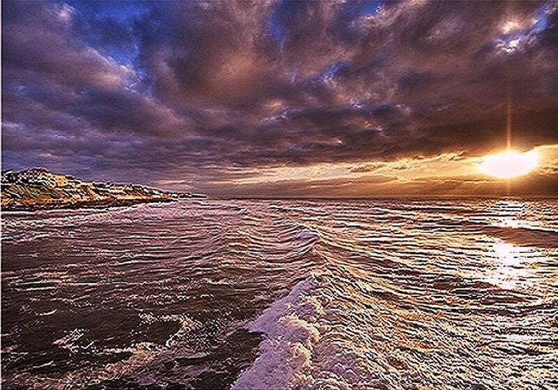 Ocean Waves at Sunset — Blue, Dramatic, Photograph, Sun, Clouds, Coastline