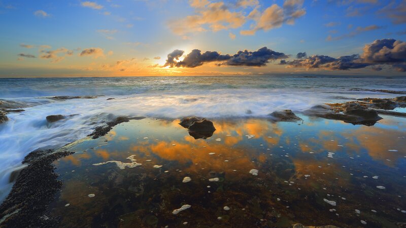 Ocean Waves at Sunset — Blue, Serene, Photograph, Clouds, Rocks, Reflection, Orange