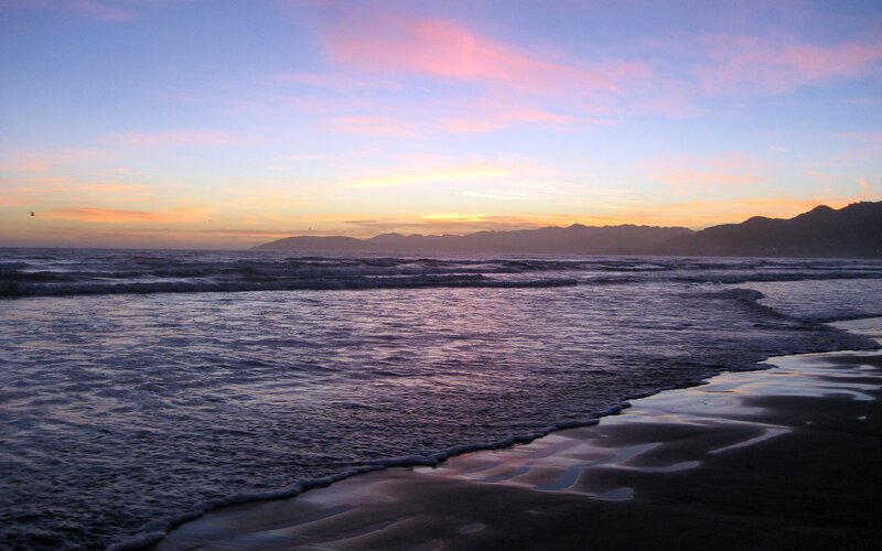 Ocean Waves at Sunset — Blue, Serene, Photograph, Mountains, Sky