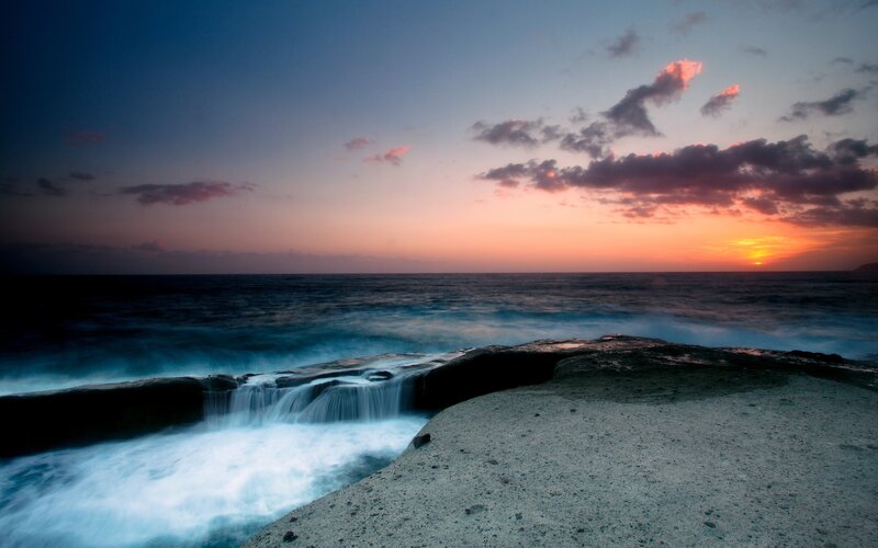 Ocean Waves at Sunset — Blue, Serene, Photograph, Rocks
