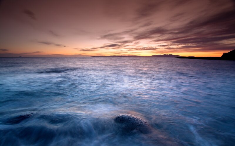 Ocean Waves at Sunset — Blue, Serene, Photograph, Sky, Clouds, Mountains