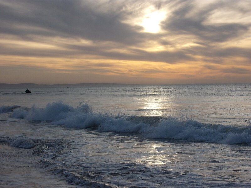 Ocean Waves at Sunset — Blue, Serene, Photograph, Sun, Clouds, Boat