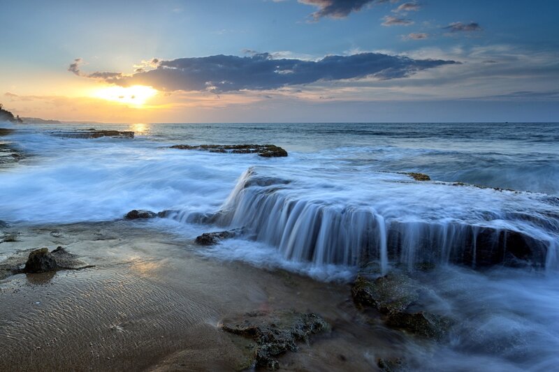 Ocean Waves at Sunset — Blue, Serene, Photograph, Sun, Clouds, Rocks