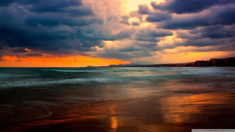 Ocean Waves at Sunset — Orange, Dramatic, Photograph, Clouds, Beach, Buildings