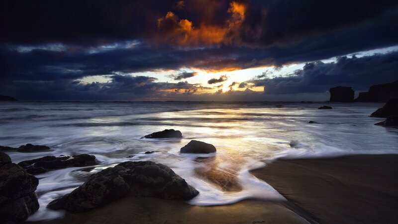 Ocean Waves at Sunset — Orange, Dramatic, Photograph, Rocks, Clouds, Sand, Blue