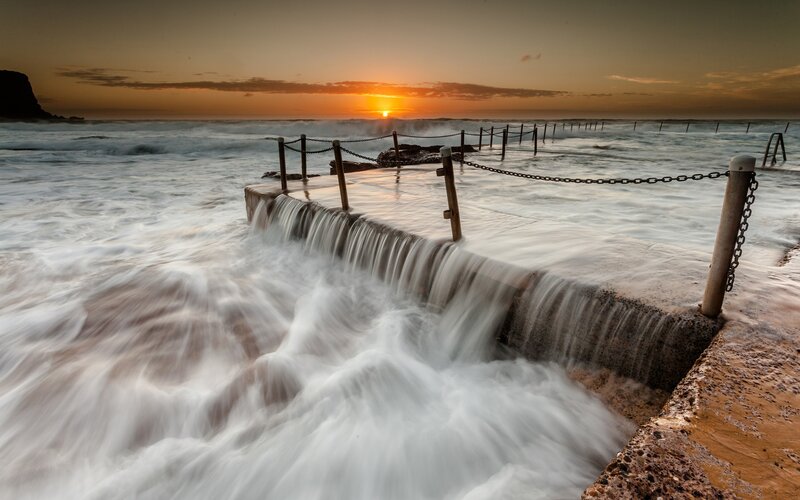 Ocean Waves at Sunset — Orange, Dramatic, Photograph, Sea, Chain Fence, Blue, White