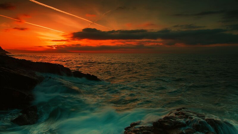 Ocean Waves at Sunset — Orange, Dramatic, Photograph, Sun, Clouds, Rocks, Boat
