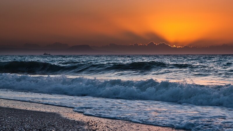 Ocean Waves at Sunset — Orange, Dramatic, Photograph, Sun, Sea, Boat, Mountain