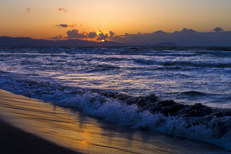 Ocean Waves at Sunset — Orange, Serene, Photograph, Sun, Clouds, Mountains