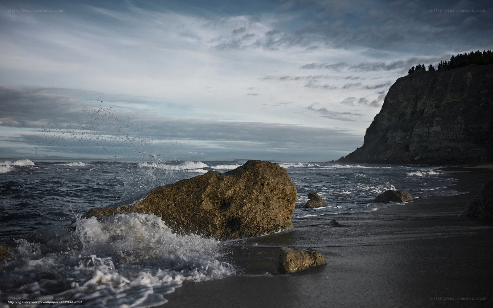 Ocean waves crash on rocky shore