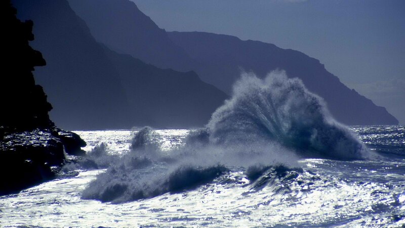 Ocean waves crashing against cliffs