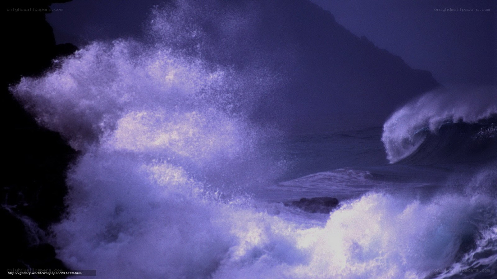 Ocean waves crashing at night