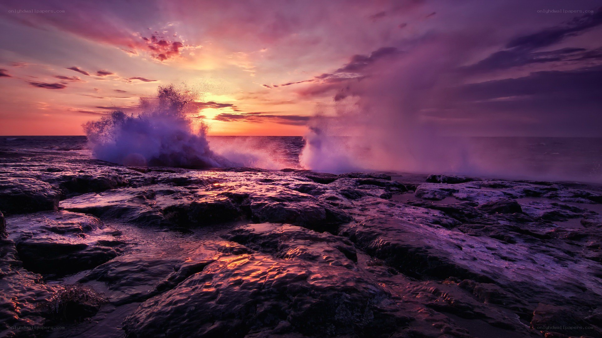 Ocean waves crashing at sunset