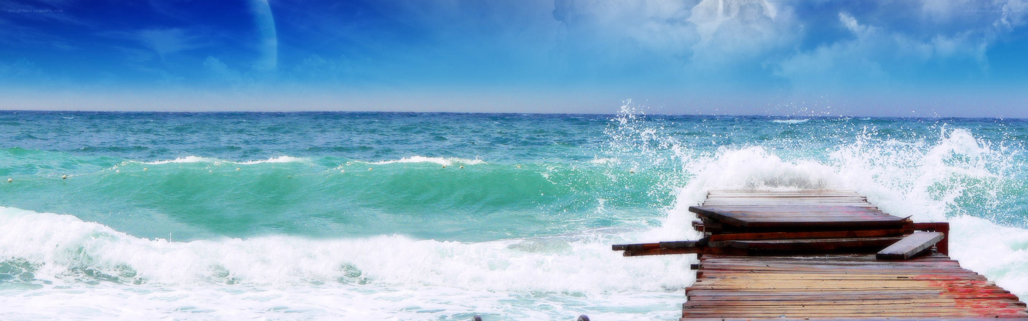 Ocean waves crashing on a pier