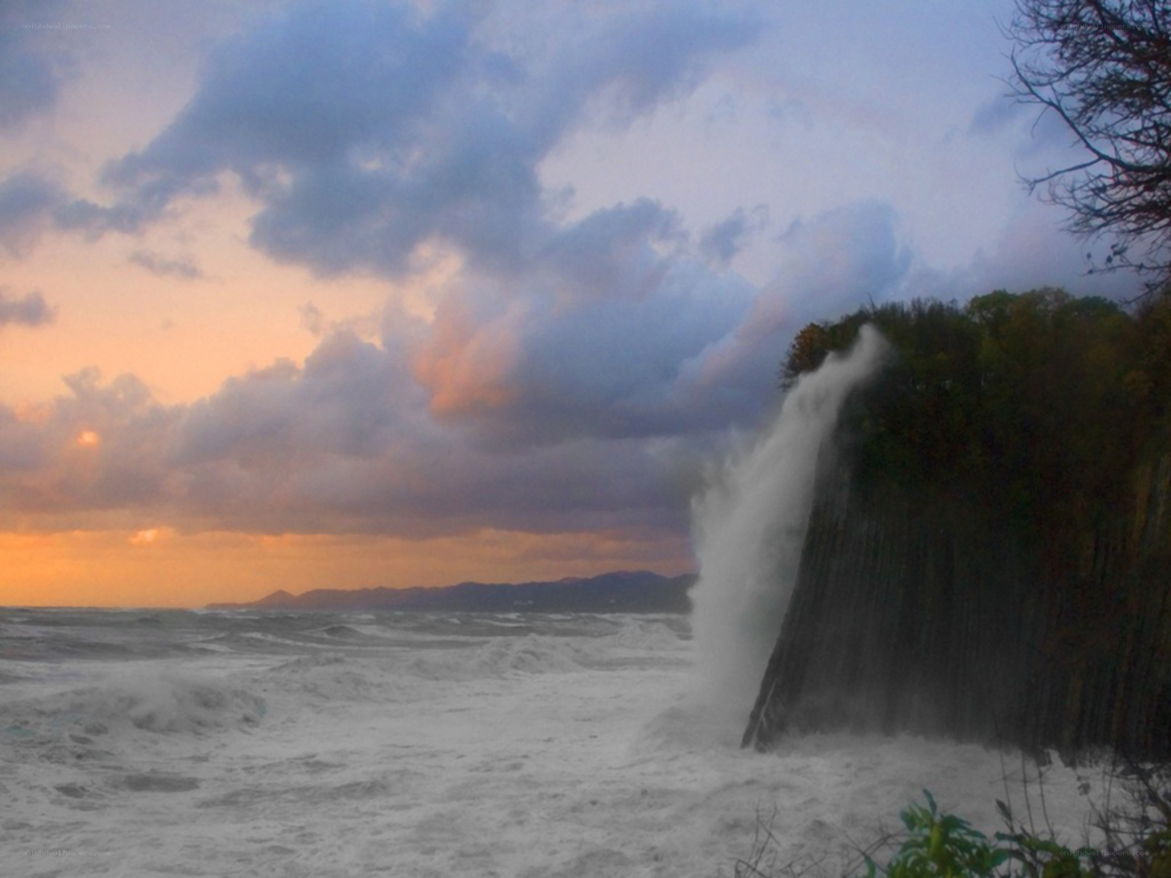 Ocean waves crashing on cliff