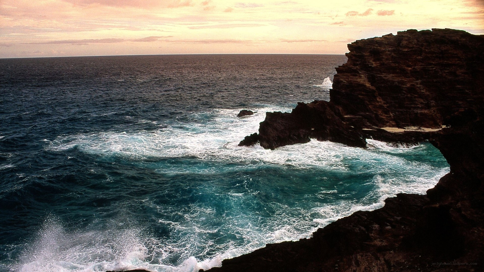 Ocean waves crashing on cliffs