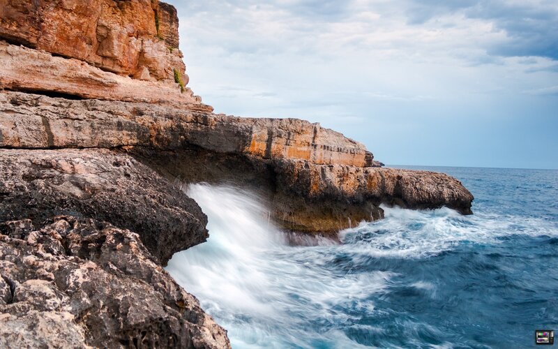 Ocean waves crashing on cliffs