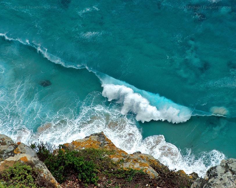 ocean waves crashing on cliffs