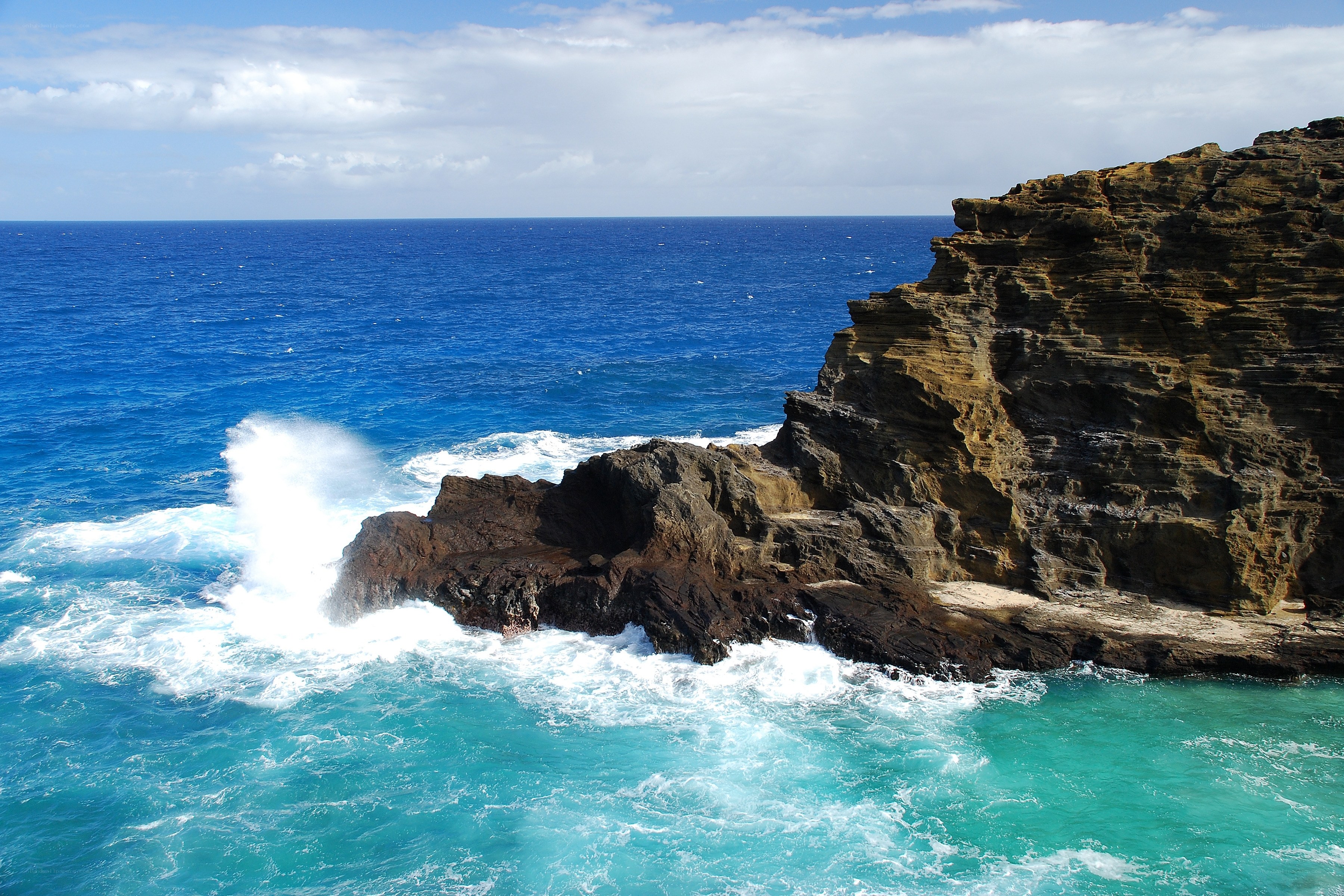 Ocean waves crashing on cliffs