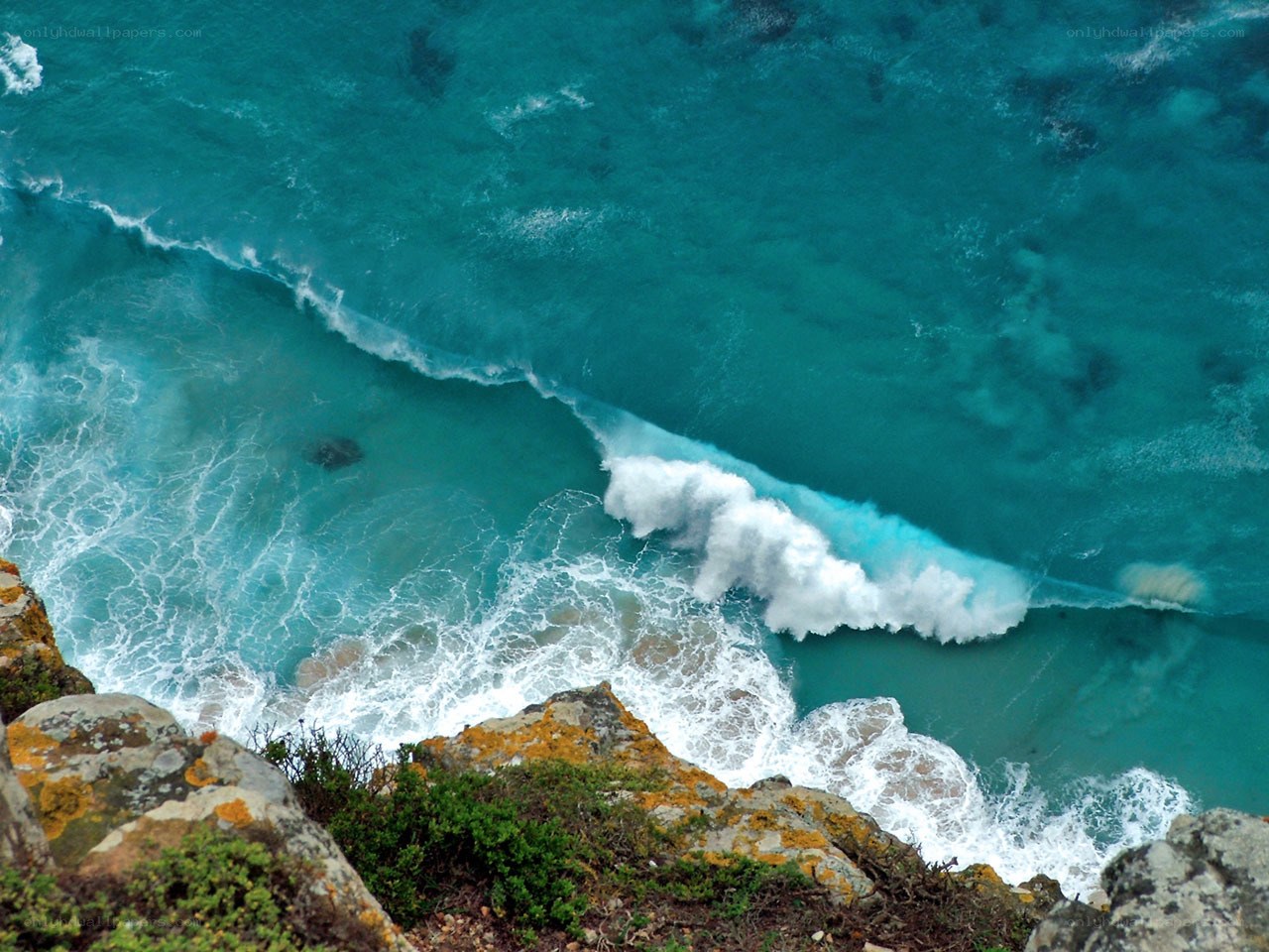 Ocean waves crashing on cliffs