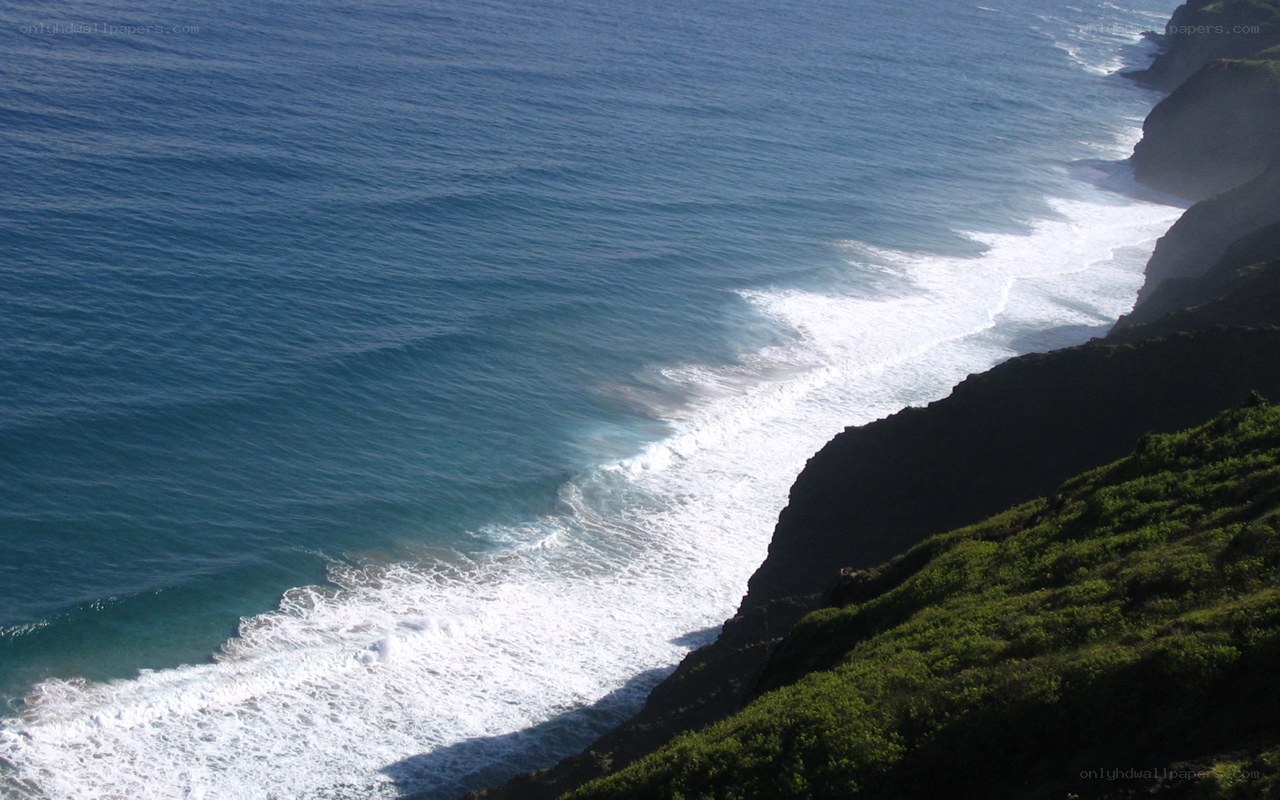 ocean waves crashing on cliffs