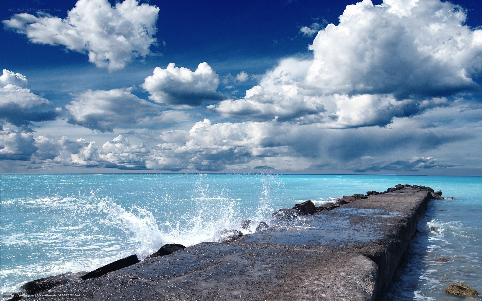 Ocean waves crashing on pier