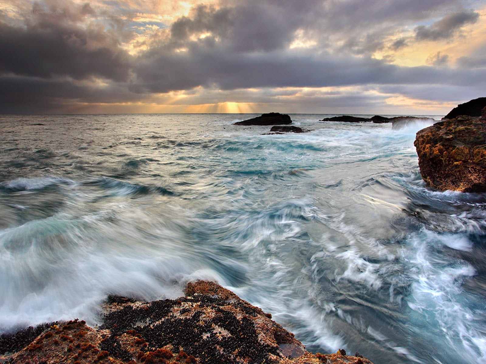 Ocean waves crashing on rocks