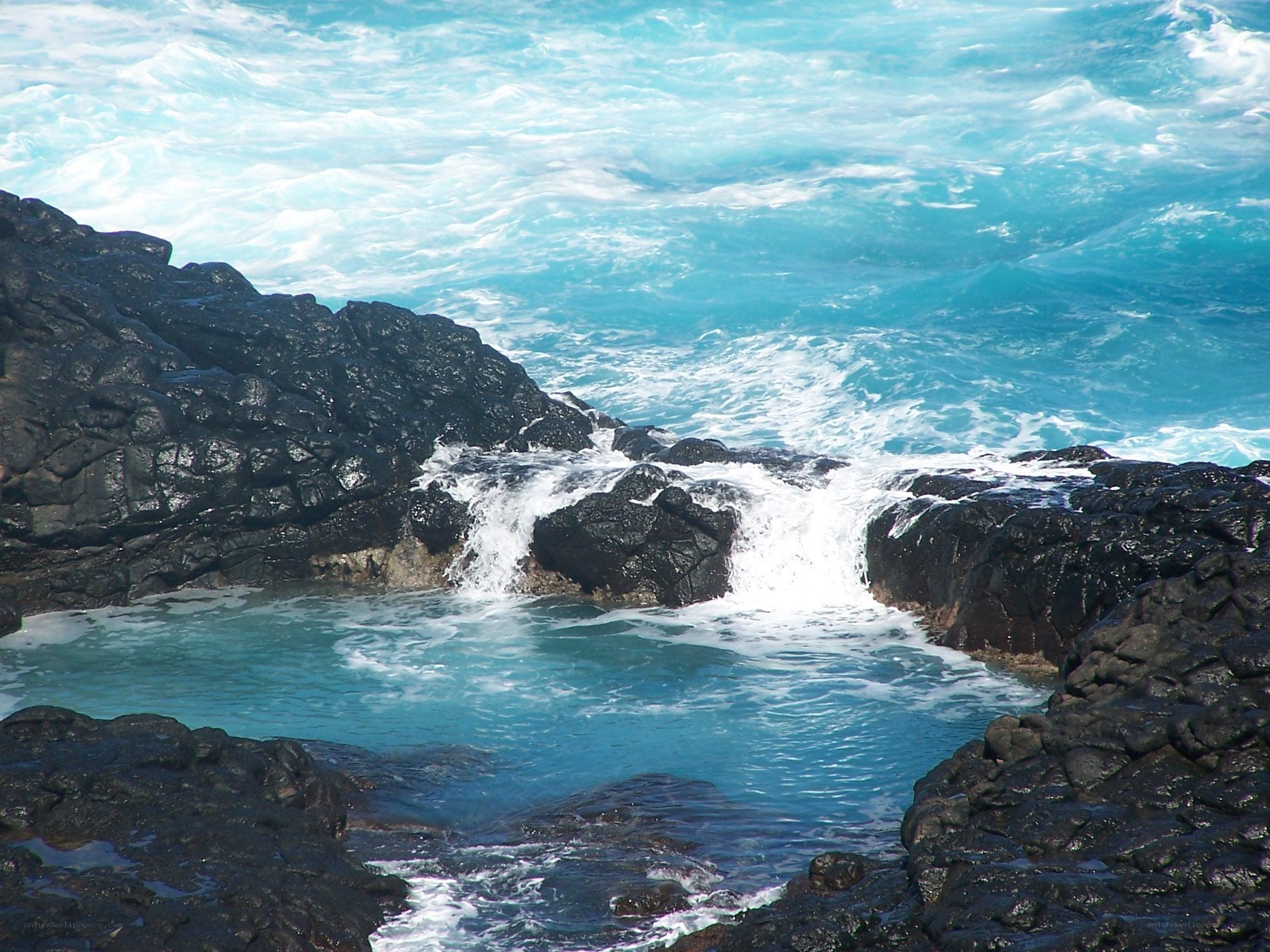 Ocean waves crashing on rocks