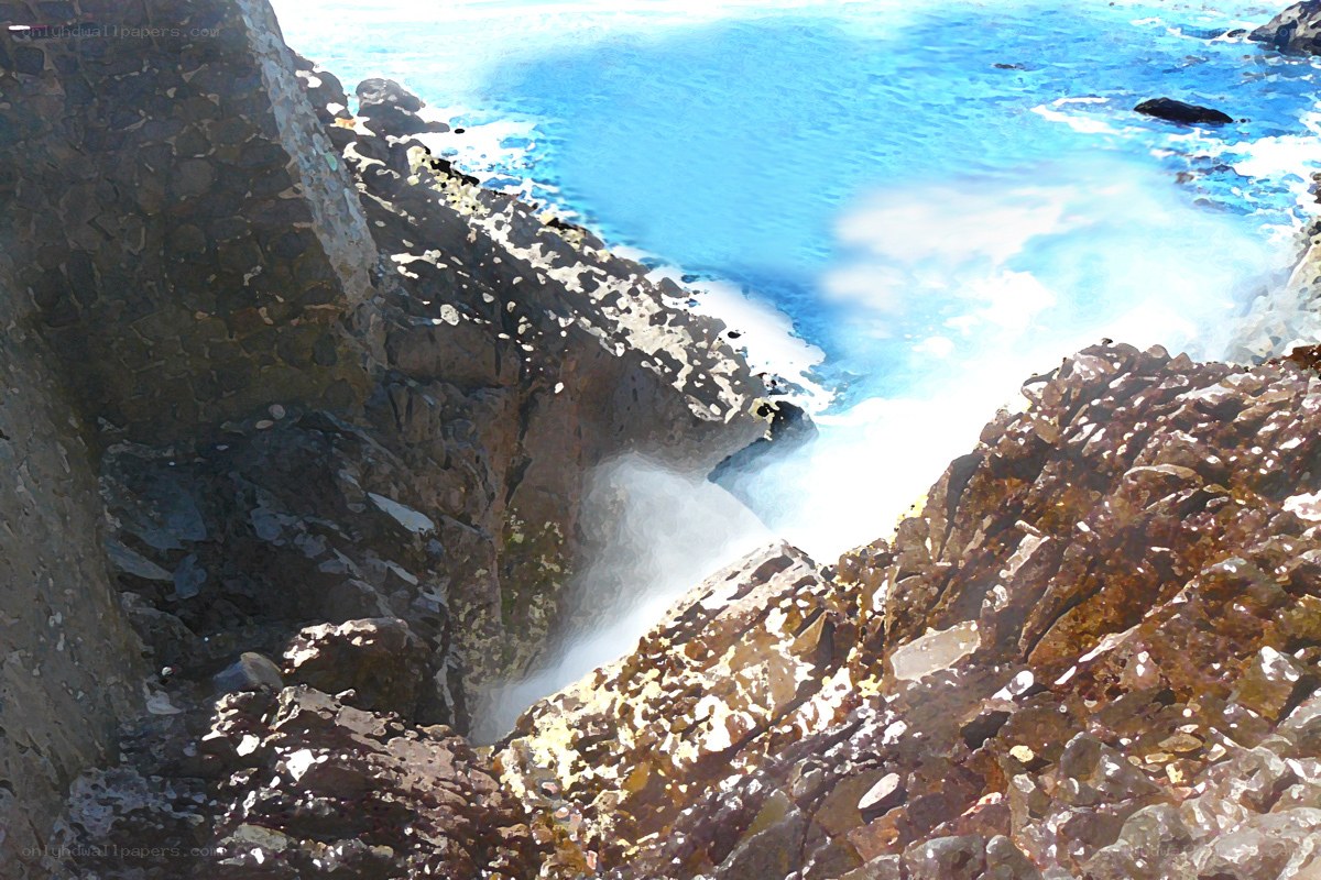 ocean waves crashing on rocks