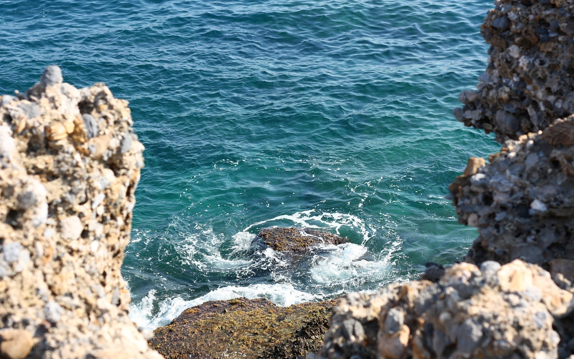 ocean waves crashing on rocks