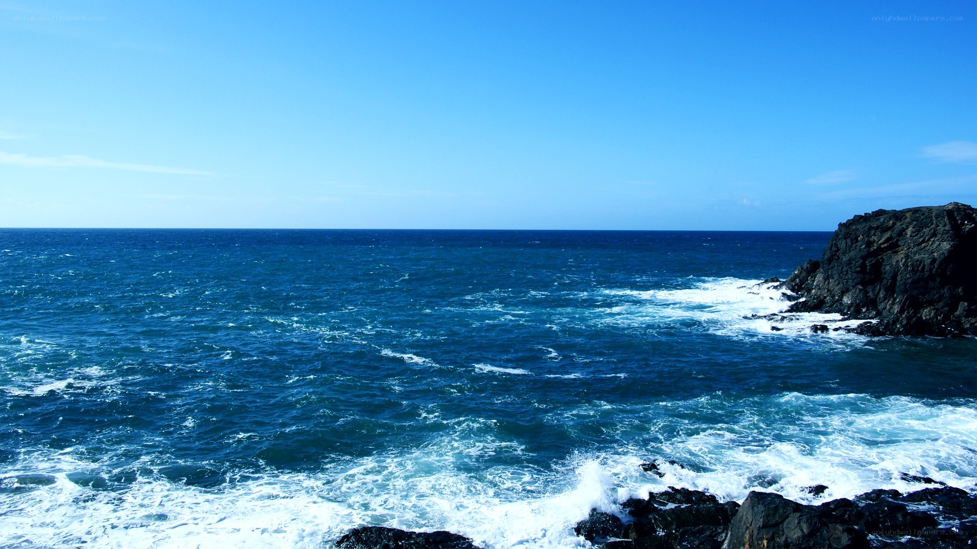 Ocean waves crashing on rocks